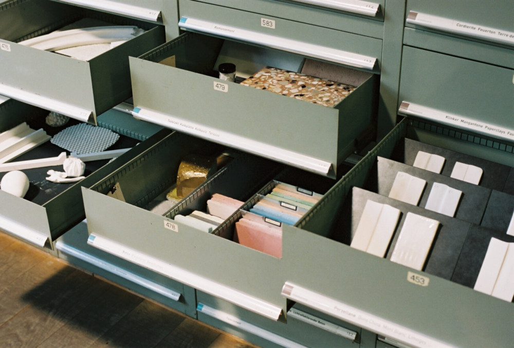 Drawers with different material samples.