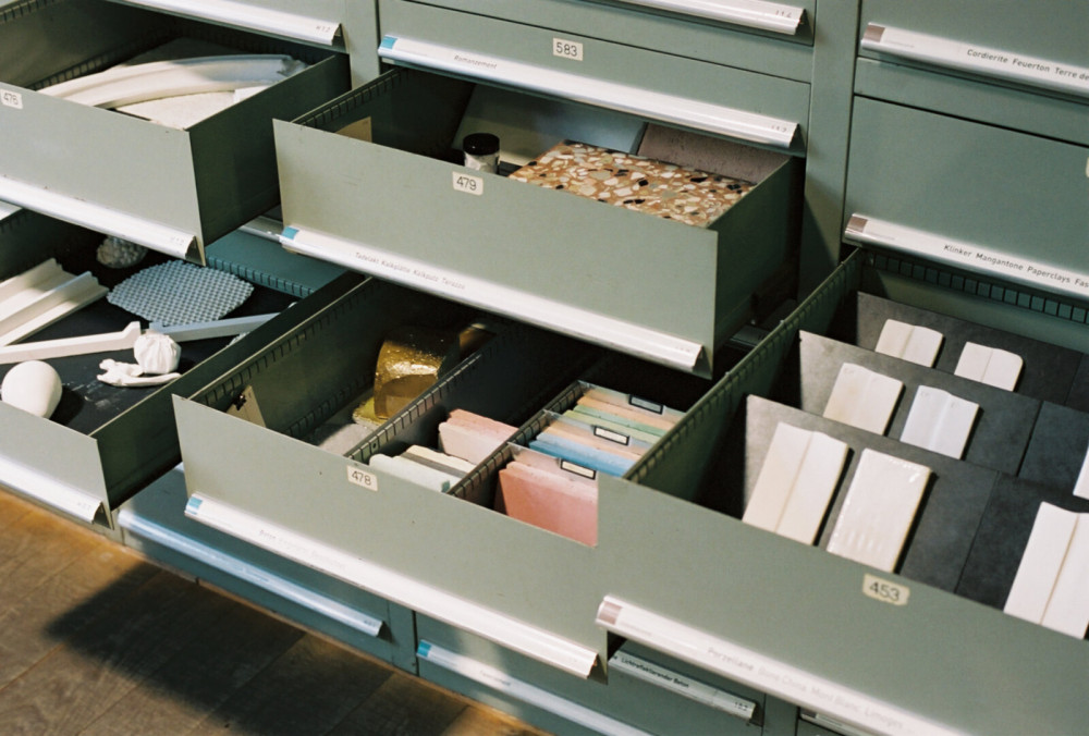 Drawers with different material samples.